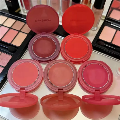 Rare Beauty cream to powder matte blush in a natural, bouncy cushiony texture, waterproof, sweatproof, and brightening for a natural flush.