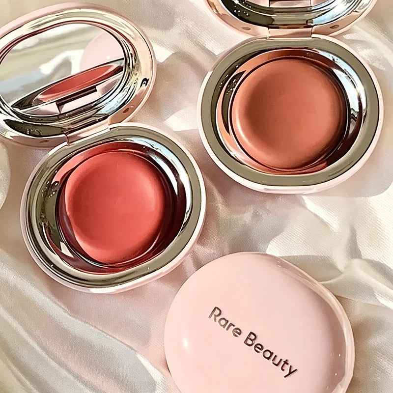 Rare Beauty creamy powder blush with soft focus, luminous glow, buildable pigment, lightweight, long-lasting rosy cheek makeup.