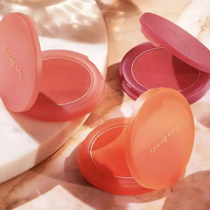 Rare Beauty liquid blush cream with dewy finish, portable multi-use cheek and lip tint, blendable and gentle makeup for a natural glow.