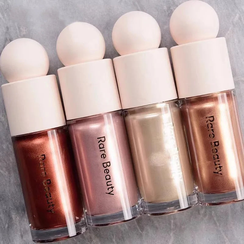 Rare Beauty liquid blush cream with sheer dewy finish, portable multi-use cheek and lip tint, blendable and gentle makeup product.