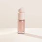 Rare Beauty liquid blush cream with sheer dewy finish, portable multi-use cheek and lip tint, gentle and blendable makeup product.