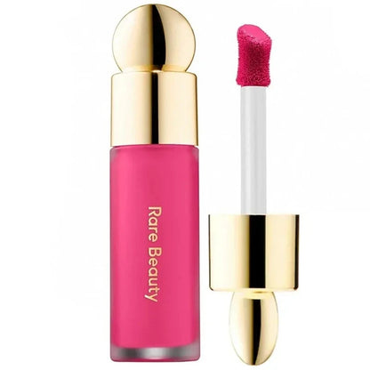 Rare Beauty liquid blush cream with dewy finish, portable, blendable cheek and lip tint, perfect for natural, gentle makeup.
