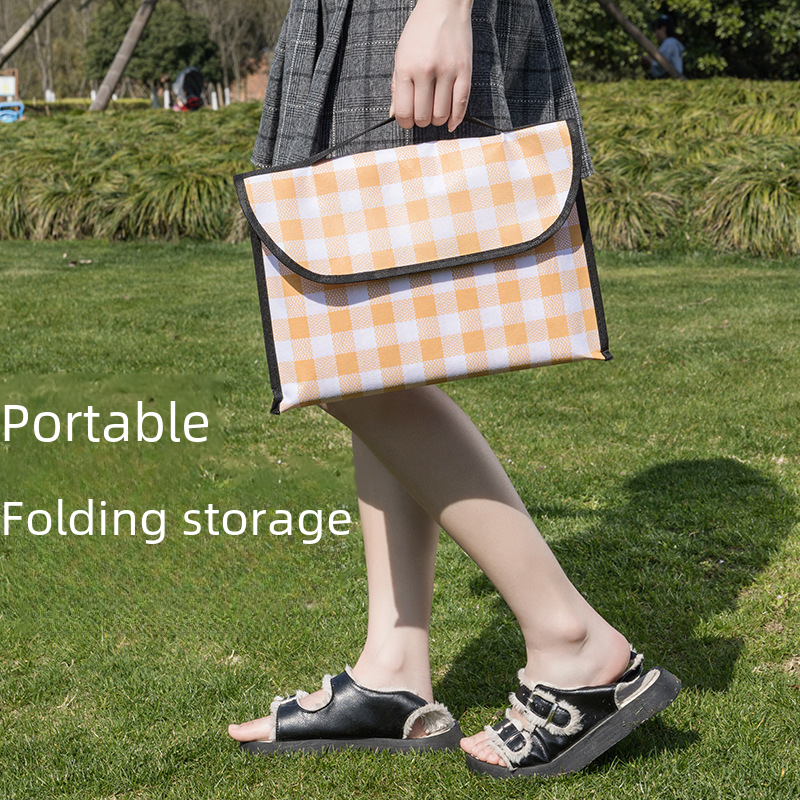 Thick waterproof picnic mat by BACKUPMYFILESNOW.COM® with a soft, cushioned surface, ideal for outdoor picnics and gatherings.