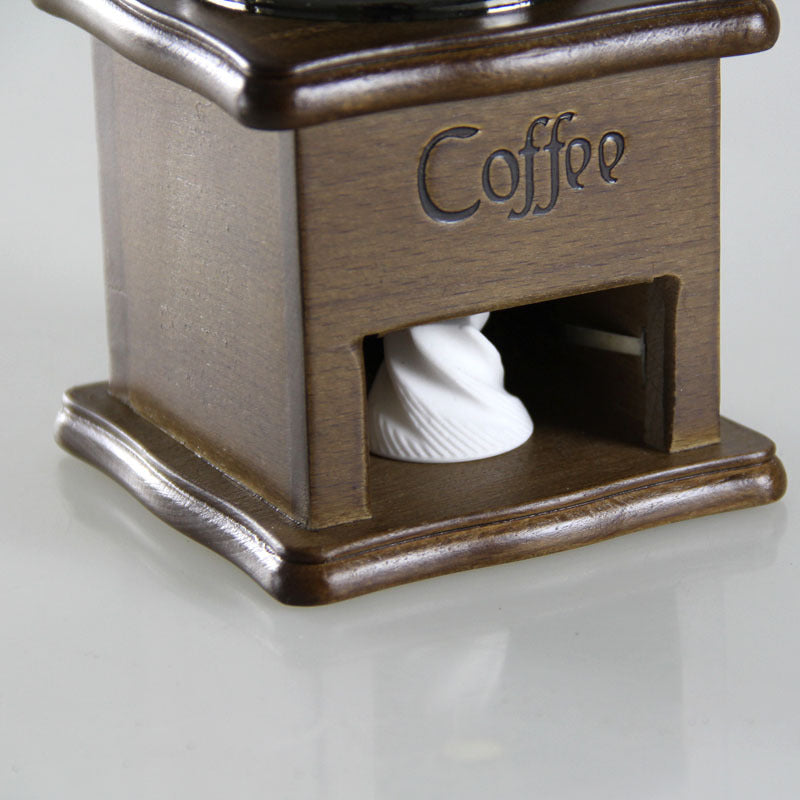 Manual coffee grinder for home use, compact mini coffee mill by BACKUPMYFILESNOW.COM® with adjustable ceramic burrs.