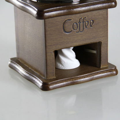Manual coffee grinder for home use, compact mini coffee mill by BACKUPMYFILESNOW.COM® with adjustable ceramic burrs.