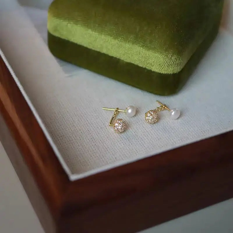 S925 pure silver earrings featuring a new niche and unique ear hole design, showcasing intricate craftsmanship and elegant style.