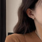 Sterling silver earrings featuring trendy, personalized designs, perfect as stylish ear accessories.