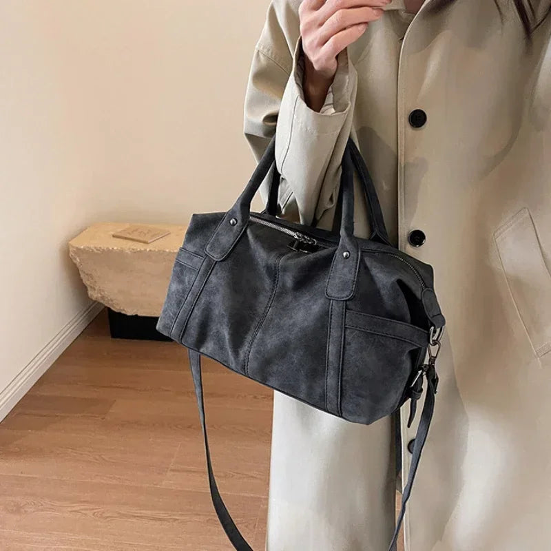Retro design PU leather shoulder bag for women, high-capacity Korean fashion crossbody tote with a stylish armpit bag look.