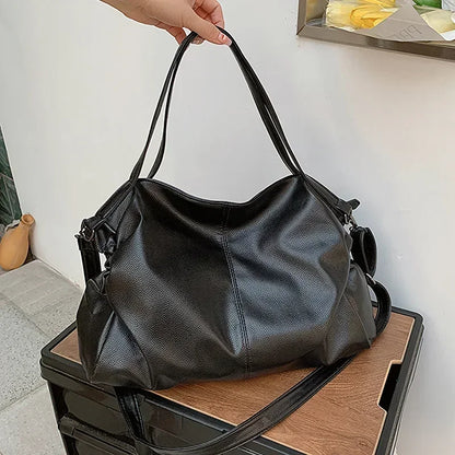 Retro design PU leather shoulder bag for women, high-capacity Korean fashion tote with crossbody strap and stylish look.