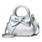 Khaki women's crossbody bag with top handle, bow tie detail, shoulder strap, and tote style, featuring a stylish and trendy design.