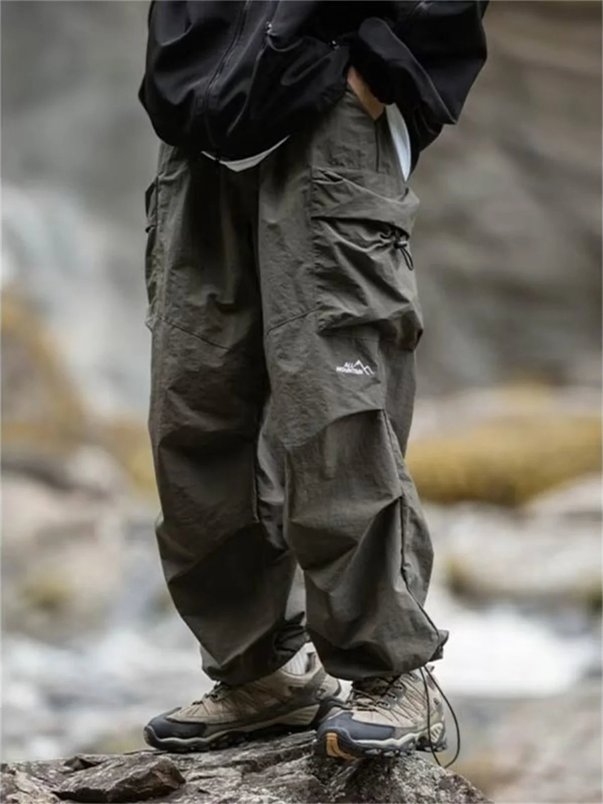 Men's waterproof spring and autumn hip hop mountaineering cargo pants by BACKUPMYFILESNOW.COM®, black casual Harajuku work pants with outwear style.