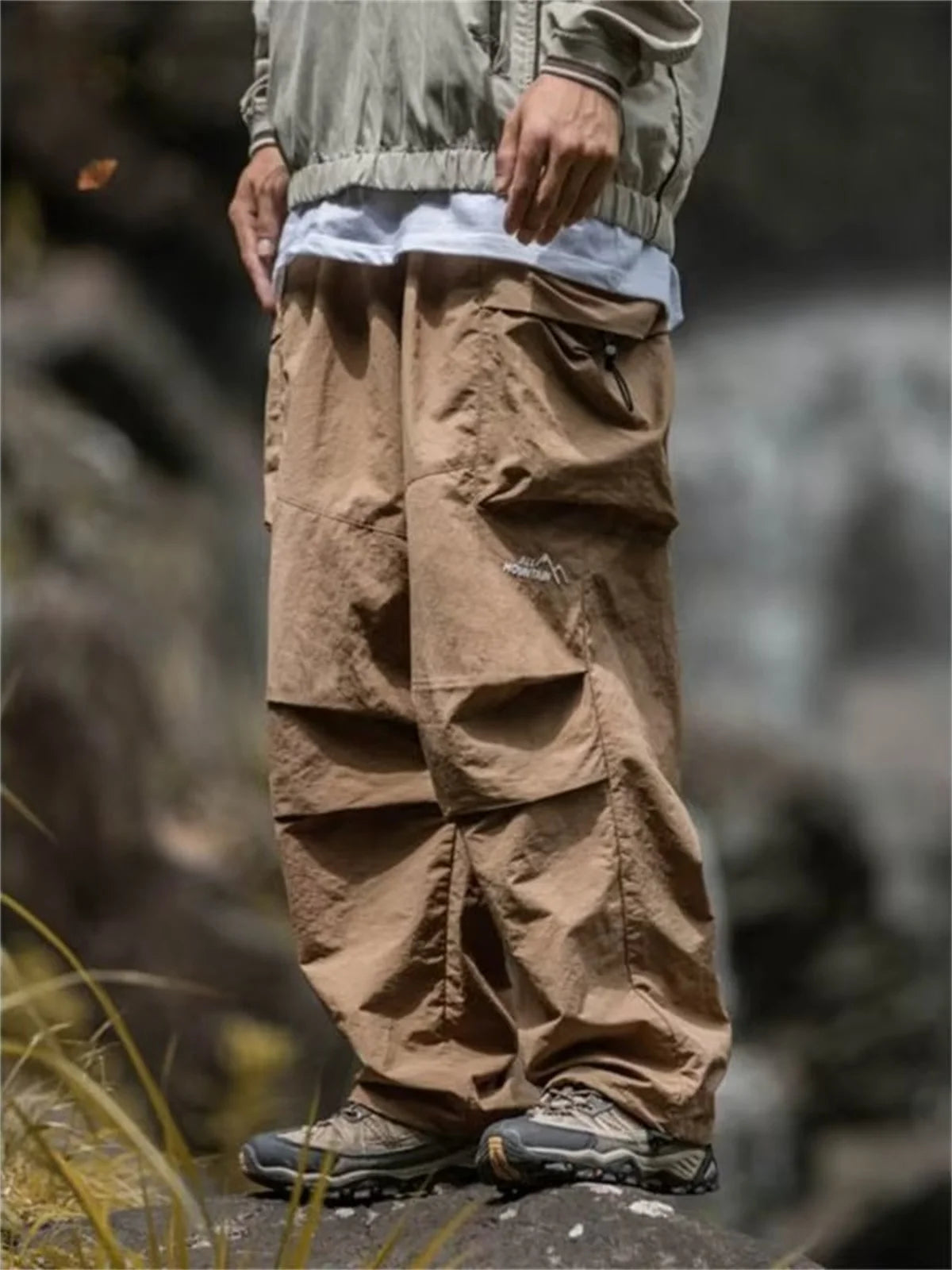Men's waterproof hip hop mountaineering pants by BACKUPMYFILESNOW.COM®, black cargo outwear pants for spring and autumn outdoor activities.