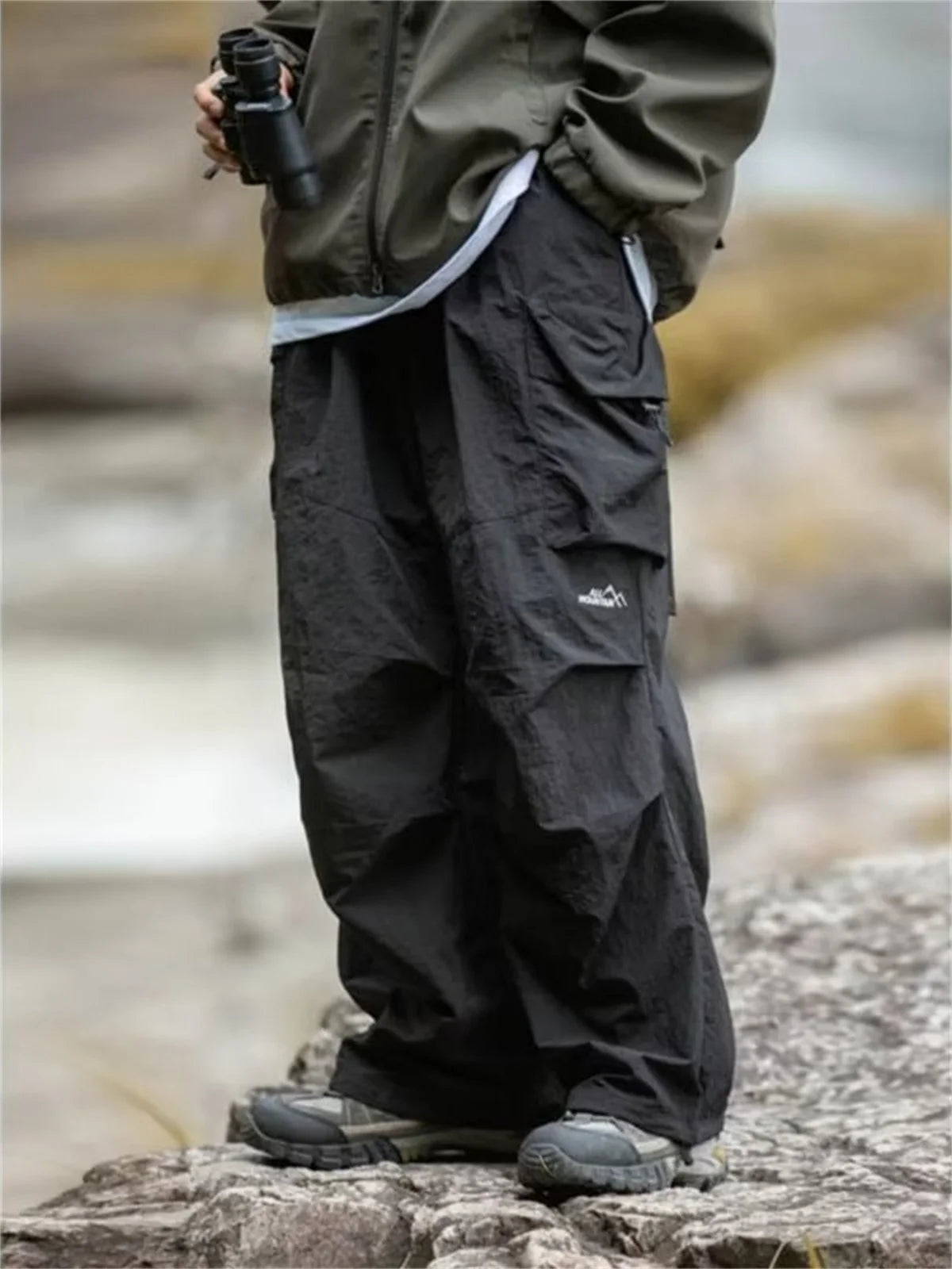 Men's waterproof hip hop mountaineering pants by BACKUPMYFILESNOW® in black, casual Harajuku work cargo outdoor pants for spring and autumn.