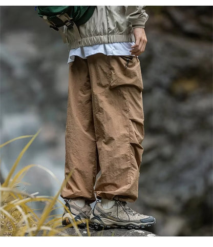 Men's waterproof spring and autumn mountain hiking pants by BACKUPMYFILESNOW® in black cargo style, casual Harajuku work wear.