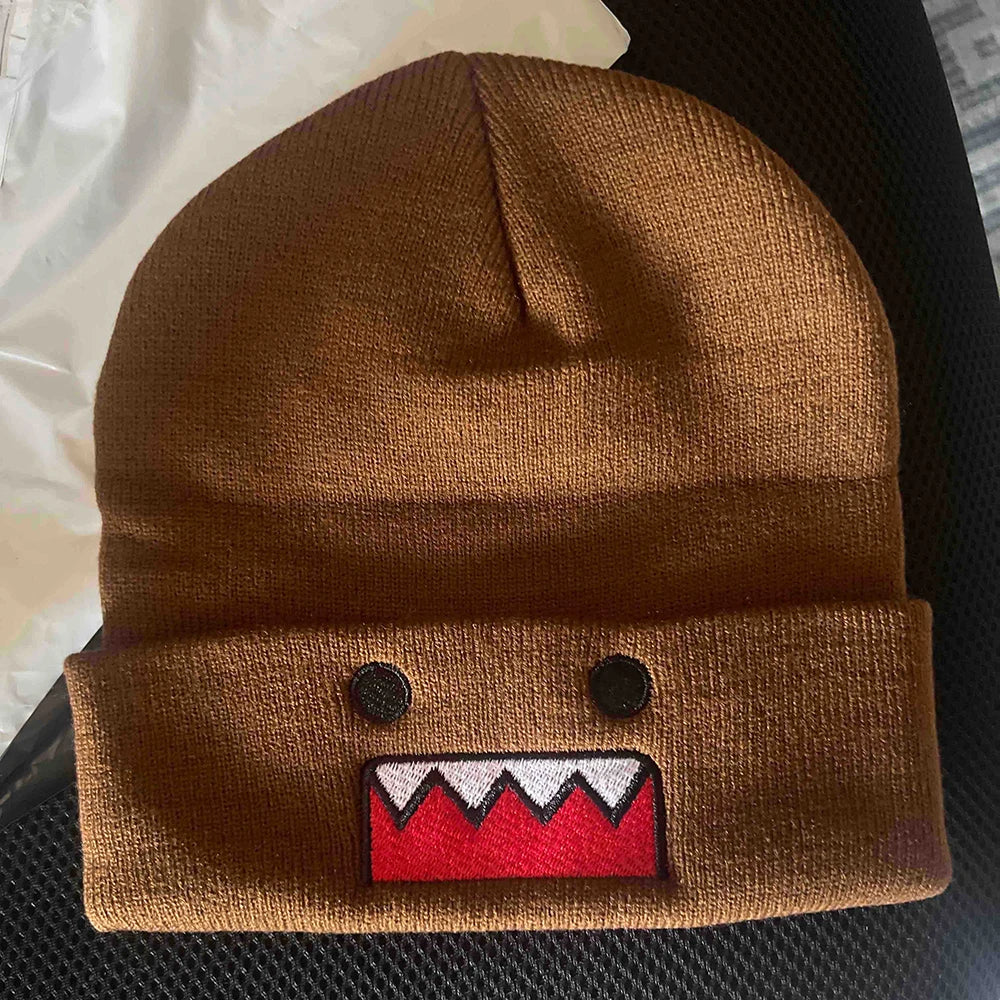 Domo Kun cartoon embroidered knitted hat in khaki, warm and windproof, suitable for men and women in autumn and winter outdoor wear.