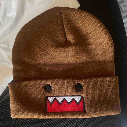 Domo Kun cartoon embroidered knitted hat in khaki, warm and windproof, suitable for men and women in autumn and winter outdoor wear.