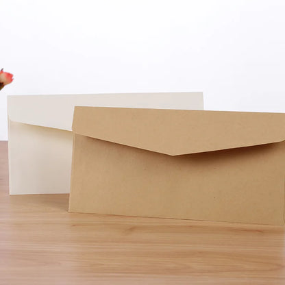 Set of 10 classical paper envelopes in white, black, and kraft with windows, ideal for wedding invitations and gift packaging.