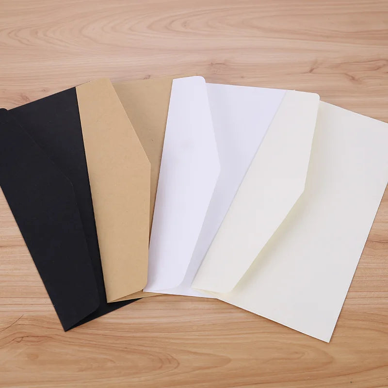 Set of 10 classical paper envelopes in white, black, and kraft with windows, ideal for wedding invitations and gift packaging.