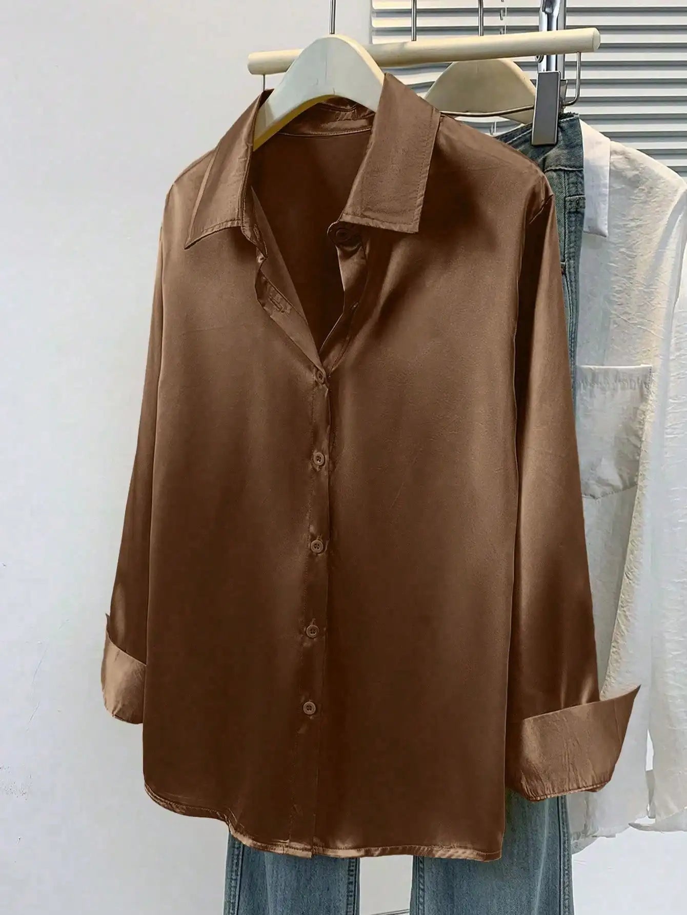 Pink women's satin button-up blouse with a collared design, ideal for office or casual wear in autumn, winter, or spring.