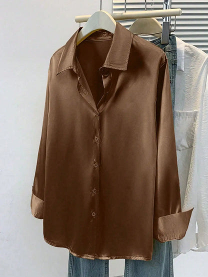 Pink women's satin button-up blouse with a collared design, ideal for office or casual wear in autumn, winter, or spring.