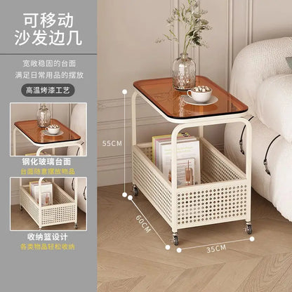 Cream-colored movable sofa trolley with simple wind design, compact side table for versatile use in living spaces.