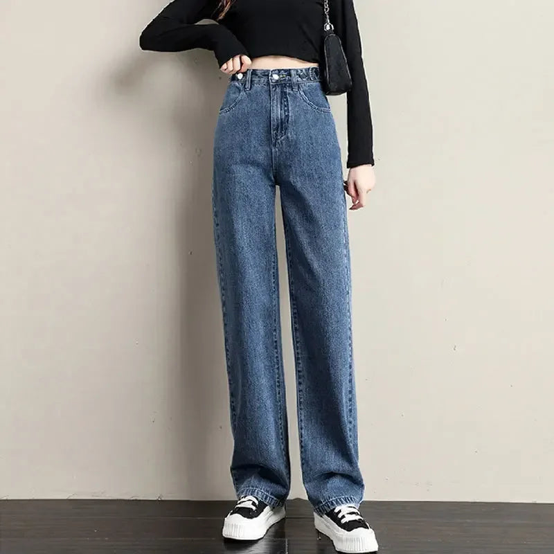 Light blue loose women’s high waist jeans with straight legs, cotton fabric, and retro style for comfortable casual wear.