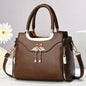 Light brown women’s shoulder bag with casual foreign style, crossbody strap, pillow shape, and underarm carrying option.