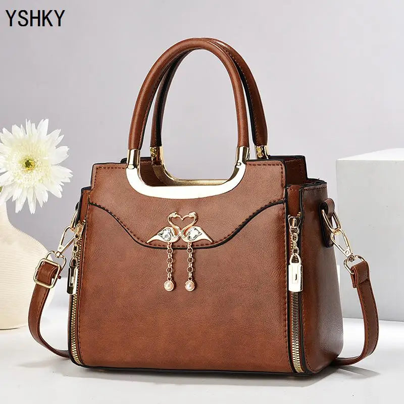 Light brown women's shoulder bag with casual foreign style, crossbody design, pillow shape, and underarm carry option.