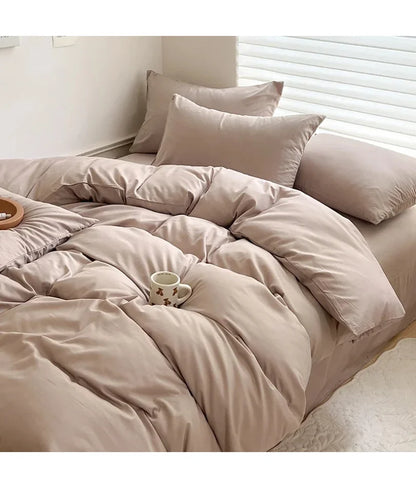 Light gray solid cotton bed linen bedding set with duvet cover, pillowcases, and sheet for single, double, queen, or king beds.
