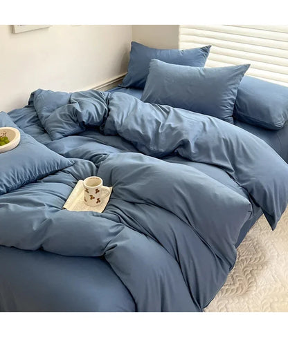 Light gray solid cotton bed linen bedding set with sheet, duvet cover, and pillowcases in various sizes including king and queen.