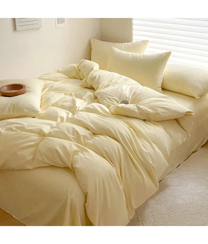 Light gray cotton bed linen set with sheet, duvet cover, and pillowcases for single, double, queen, and king beds.
