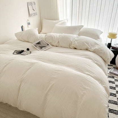 Light gray cotton bedding set with duvet cover, pillowcases, and sheets in various sizes, featuring solid bed linen design.