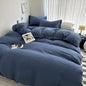 Light gray solid cotton bedding set with duvet cover, pillowcases, and sheet for single, double, queen, or king beds.