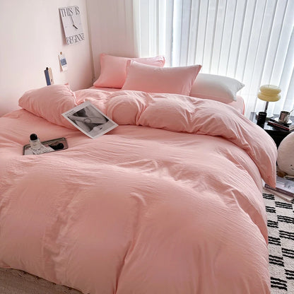 Light gray solid cotton bedding set with duvet cover, sheet, and pillowcases for single, queen, king, or twin beds.