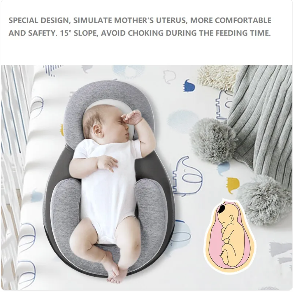 Light grey baby anti-spit up pillow with safety strap from BackupMyFilesNow.com, designed to keep babies comfortable and reduce spit-up.