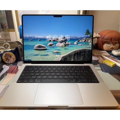 2024 MacBook Pro M4Max 14-inch laptop with 14-core CPU, 32-core GPU, 1TB storage, and 64GB RAM, open with screen visible.