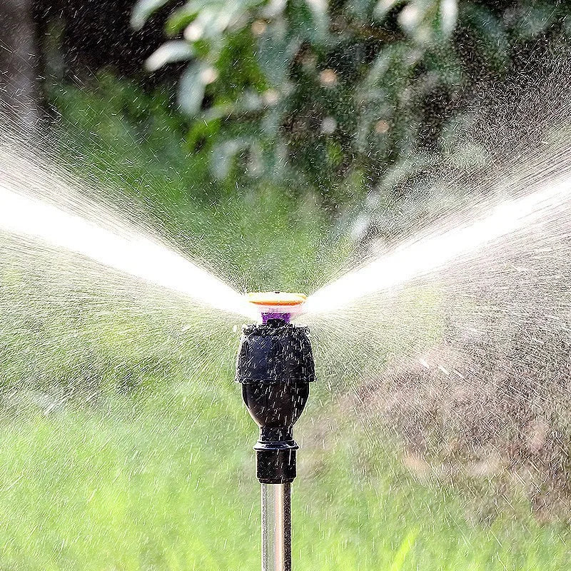 Rotating stainless steel sprinkler with variable flow control for high-pressure garden irrigation system, suitable for automatic watering.