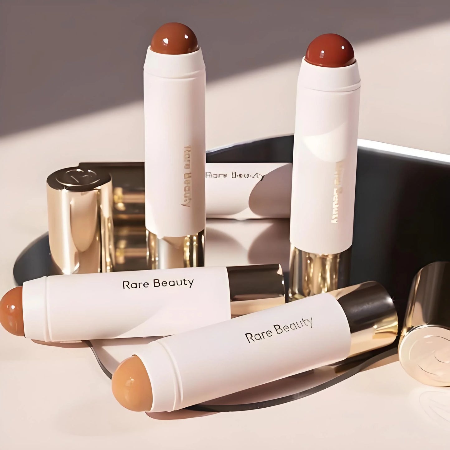 Rare Beauty Always Sunny Happy Sol bronze contour stick for natural, three-dimensional nose shadow and matte makeup finish.