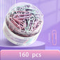 Mixed color paper clips from BackupMyFilesNow.com, large file bookmarks and storage boxes for office stationery and organization.
