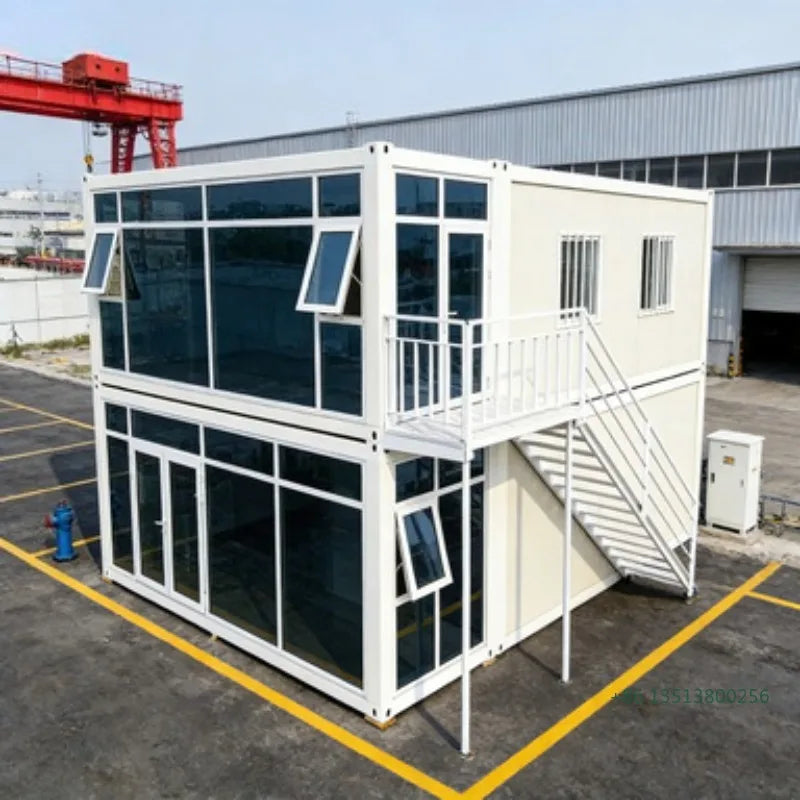 Double-story duplex container house by BACKUPMYFILESNOW.COM® with modern design, featuring 2-5 bedrooms, kitchen, and bathroom.