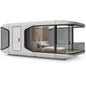 Two-storey luxury modular tiny house with steel frame, prefabricated design, featuring modern architecture and large windows.