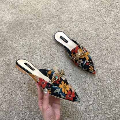 Women's designer floral embroidered slippers with metal chains, closed toe slides, flats, low heels, and flip flop style sandals.
