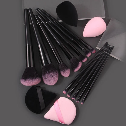 Set of 12 soft makeup brushes, 4 beauty eggs, and a triangular powder puff for professional and portable beauty application.