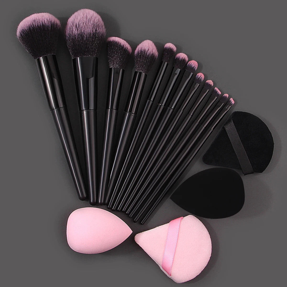 Set of 12 soft makeup brushes, 4 beauty eggs, and a triangular powder puff for professional makeup application and portability.