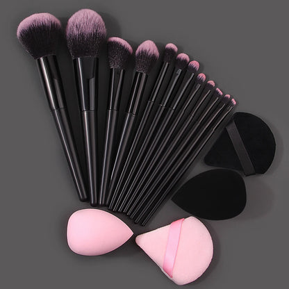 Set of 12 soft makeup brushes, 4 beauty eggs, and a triangular powder puff for professional makeup application and portability.