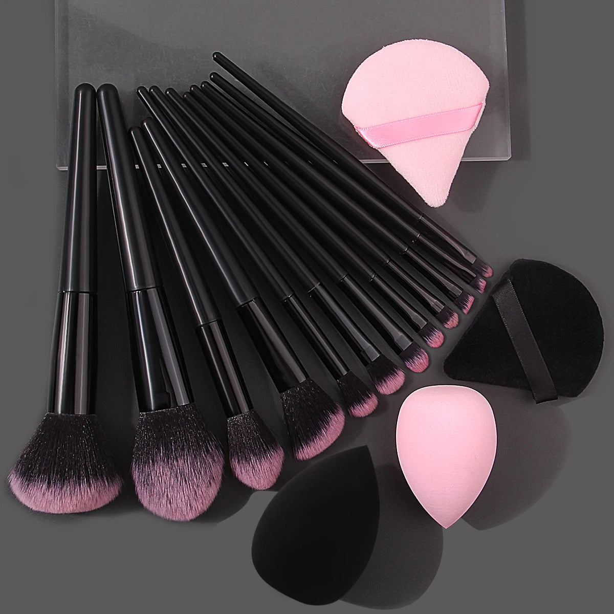 Set of 12 high-quality soft makeup brushes, 4 beauty eggs, and triangular powder puff for portable beauty application.