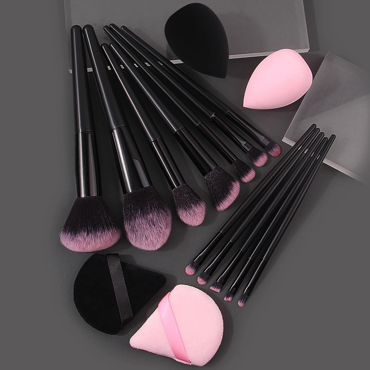 Set of 12 soft makeup brushes, 4 beauty eggs, and a triangular powder puff, perfect for portable beauty application.