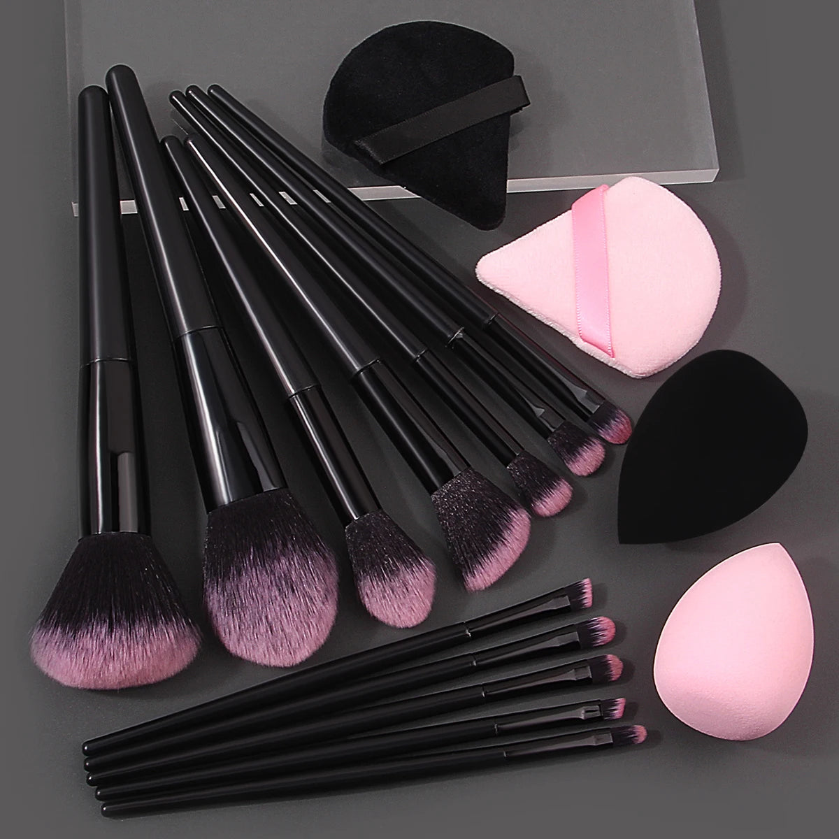 Set of 12 soft makeup brushes, 4 beauty eggs, and a triangular powder puff, ideal for portable beauty and makeup application.