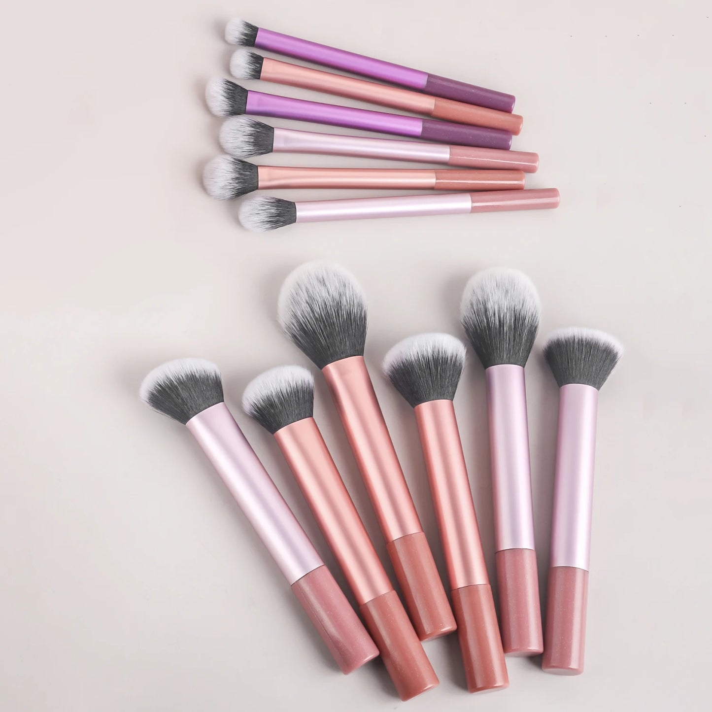 Colorful 12-piece professional makeup brush set by BackupMyFilesNow.com, featuring multifunctional cosmetic brushes for makeup application.