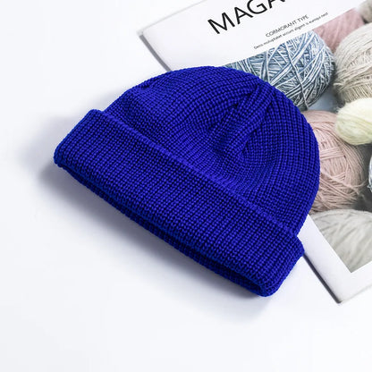 Warm knitted wool beanie cap for men and women, featuring a simple, solid color design perfect for autumn and winter fashion.
